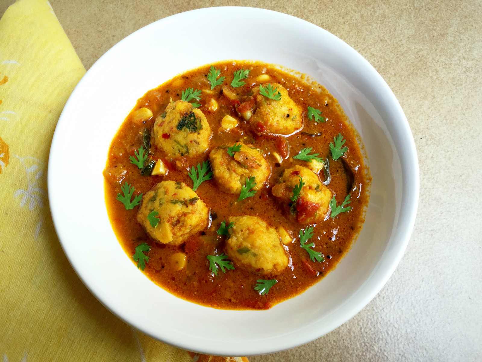 Chettinad Paruppu Urundai Kuzhambu (Steamed Lentil Balls Cooked in a Tangy Curry) Recipe